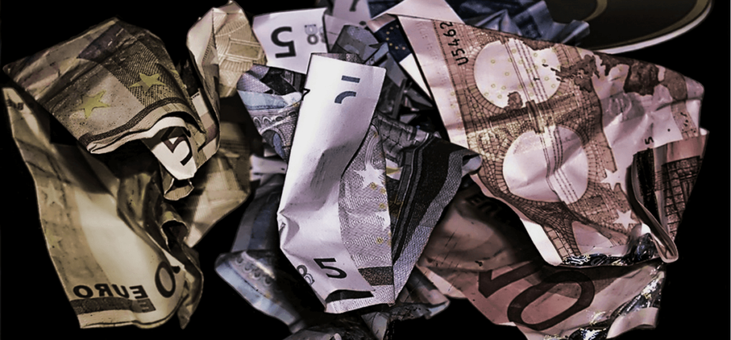 crumbled up euro bills